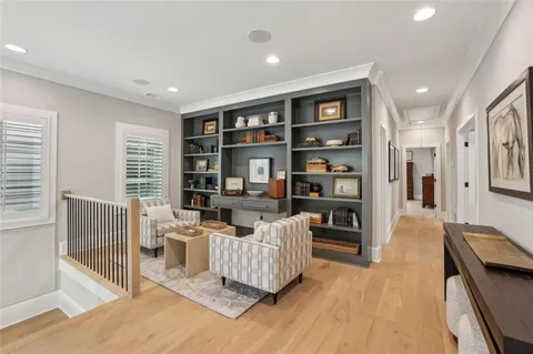 a living room with furniture and windows