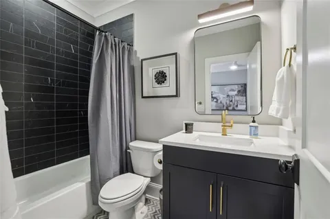 a bedroom with a bed and glass window