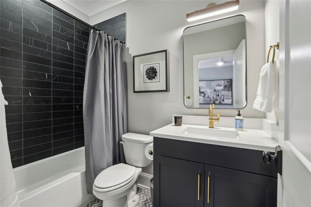 2591 Apple Valley Road Brookhaven, GA 30319 - Photo 27 of 31 a bathroom with a sink toilet and shower
