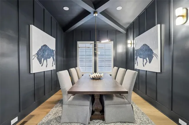 a dining room with furniture and window