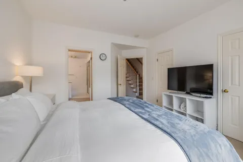 a hotel room with a television and a bed