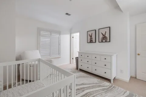 a view of a hallway with windows and stairs