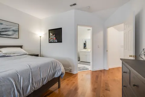 a bedroom with a bed and a table