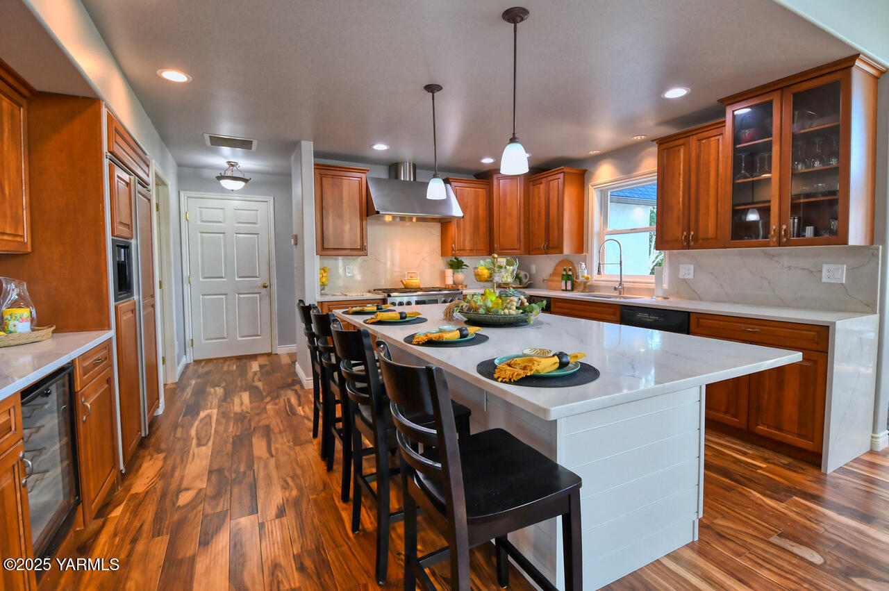 15783 Fisk Road Yakima, WA 98908 - Photo 17 of 61 a kitchen with a table chairs and a refrigerator