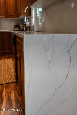 a bathroom with a tub and window