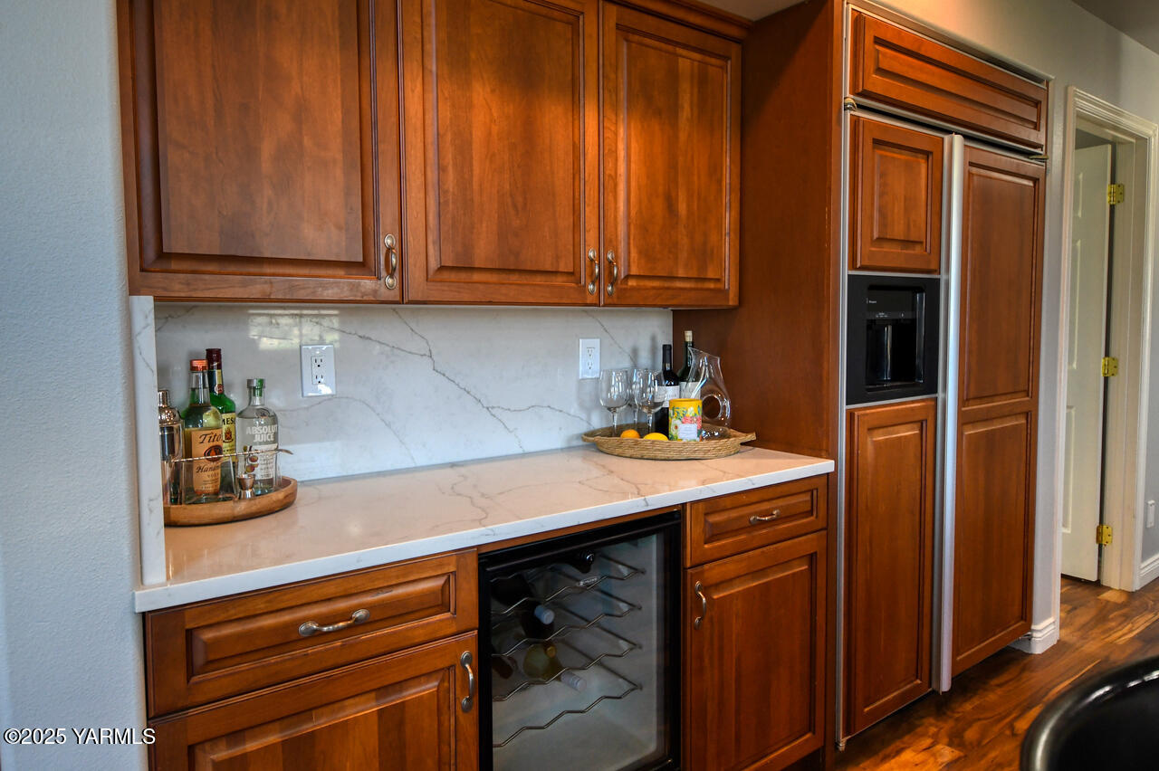 15783 Fisk Road Yakima, WA 98908 - Photo 23 of 61 a room with stainless steel appliances wooden cabinets and a counter top space