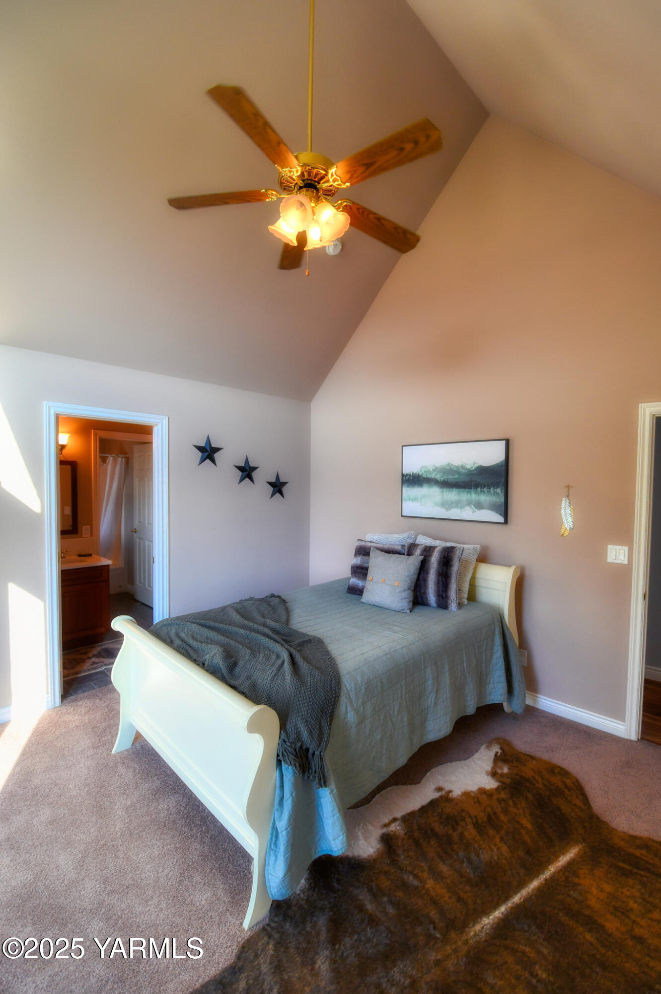 15783 Fisk Road Yakima, WA 98908 - Photo 47 of 61 a bedroom with a bed and a chandelier