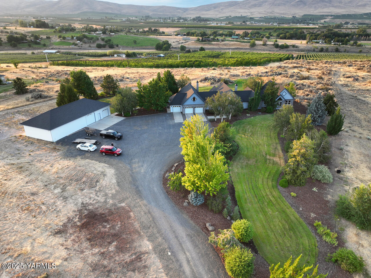 15783 Fisk Road Yakima, WA 98908 - Photo 53 of 61 an aerial view of a house with a garden and lake view