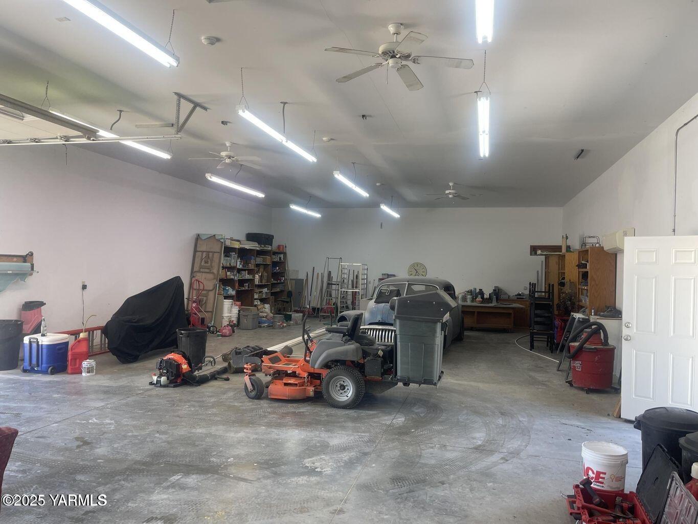 15783 Fisk Road Yakima, WA 98908 - Photo 58 of 61 a view of a garage with a bike and car
