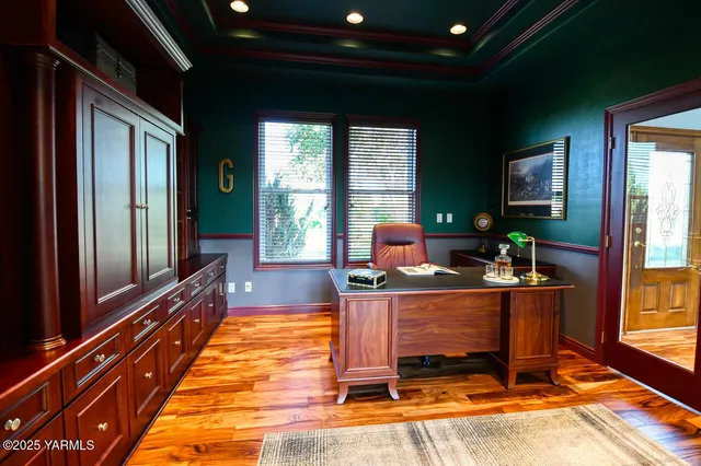 a living room with fireplace furniture and a wooden floor