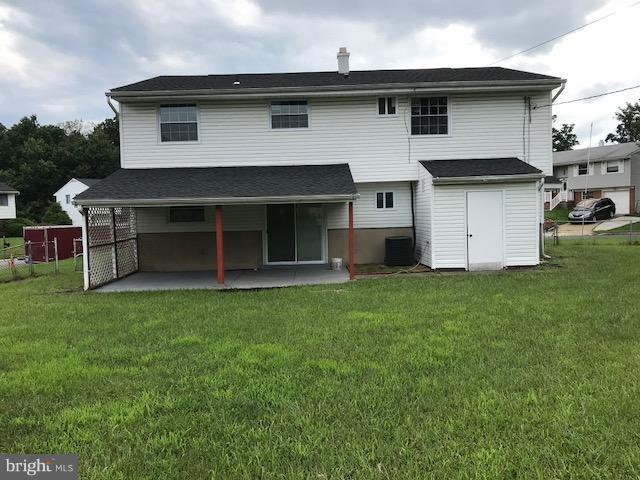 3901 Sadie Road Randallstown, MD 21133 - Photo 22 of 28 a front view of a house with a garden