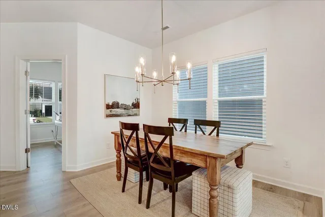 a kitchen with stainless steel appliances a sink a stove top oven a counter space and cabinets