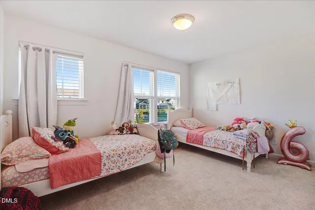 a bedroom with a bed and a lamp