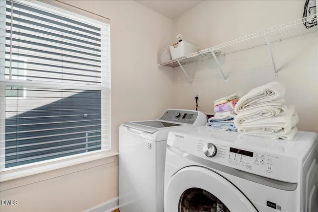 a bedroom with furniture and window
