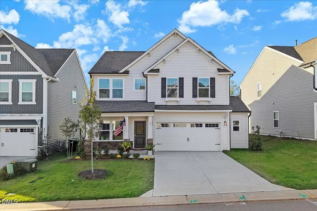 a view of house with garden space and street view