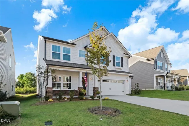 a view of house with yard