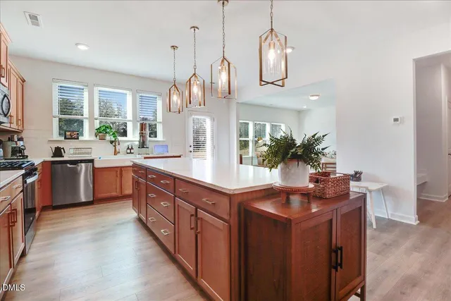 a dining room with furniture and wooden floor