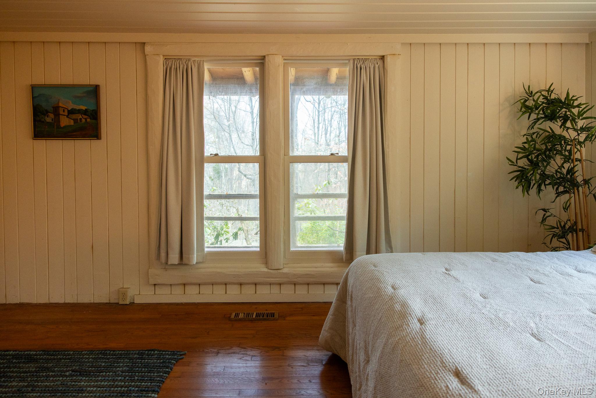 79 Torre Rock Road Red Hook, NY 12571 - Photo 21 of 33 Bedroom featuring wooden walls, hardwood / wood-style floors, and wood ceiling