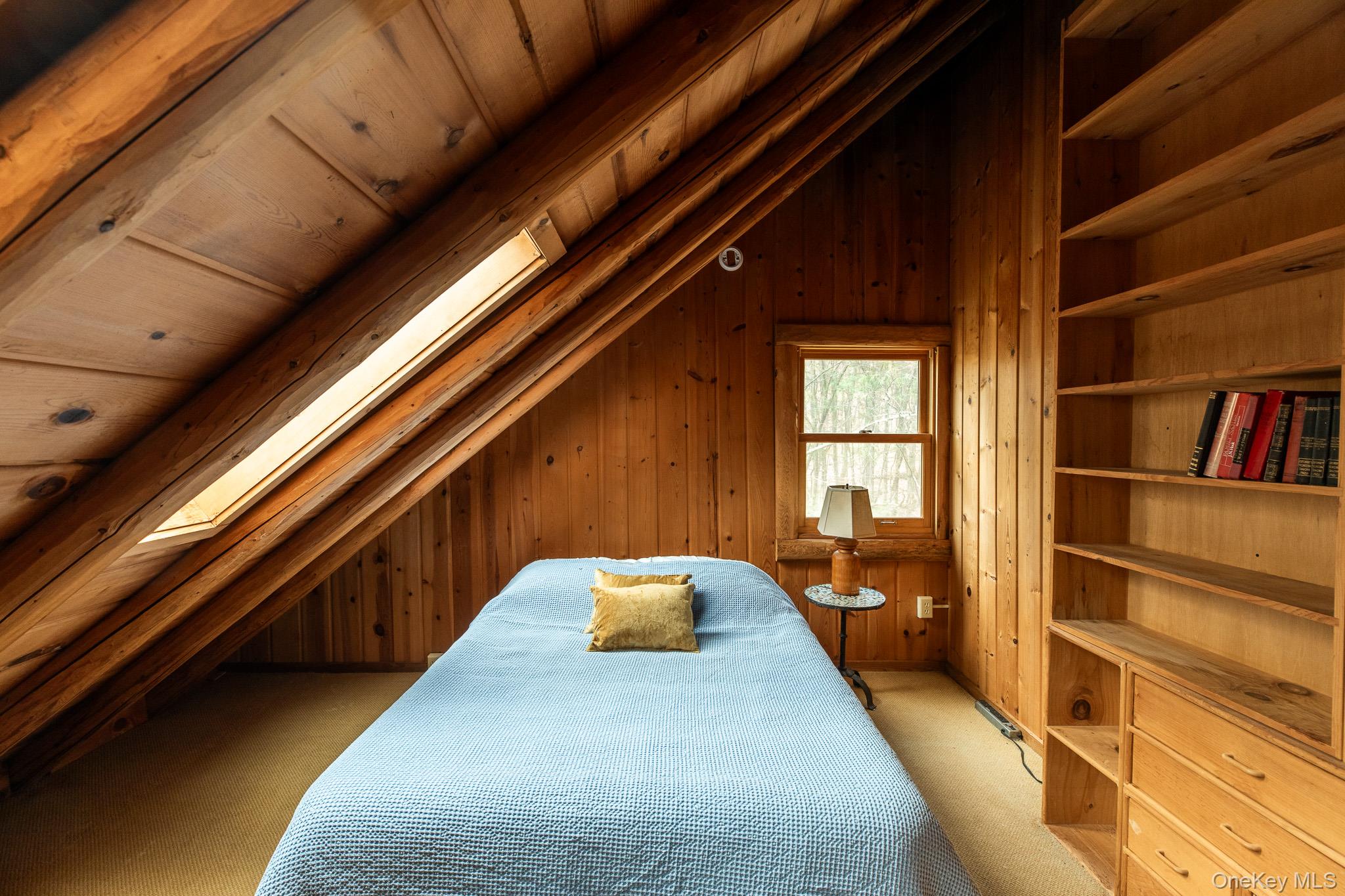 79 Torre Rock Road Red Hook, NY 12571 - Photo 24 of 33 Bedroom with vaulted ceiling, wooden walls, light colored carpet, and wood ceiling