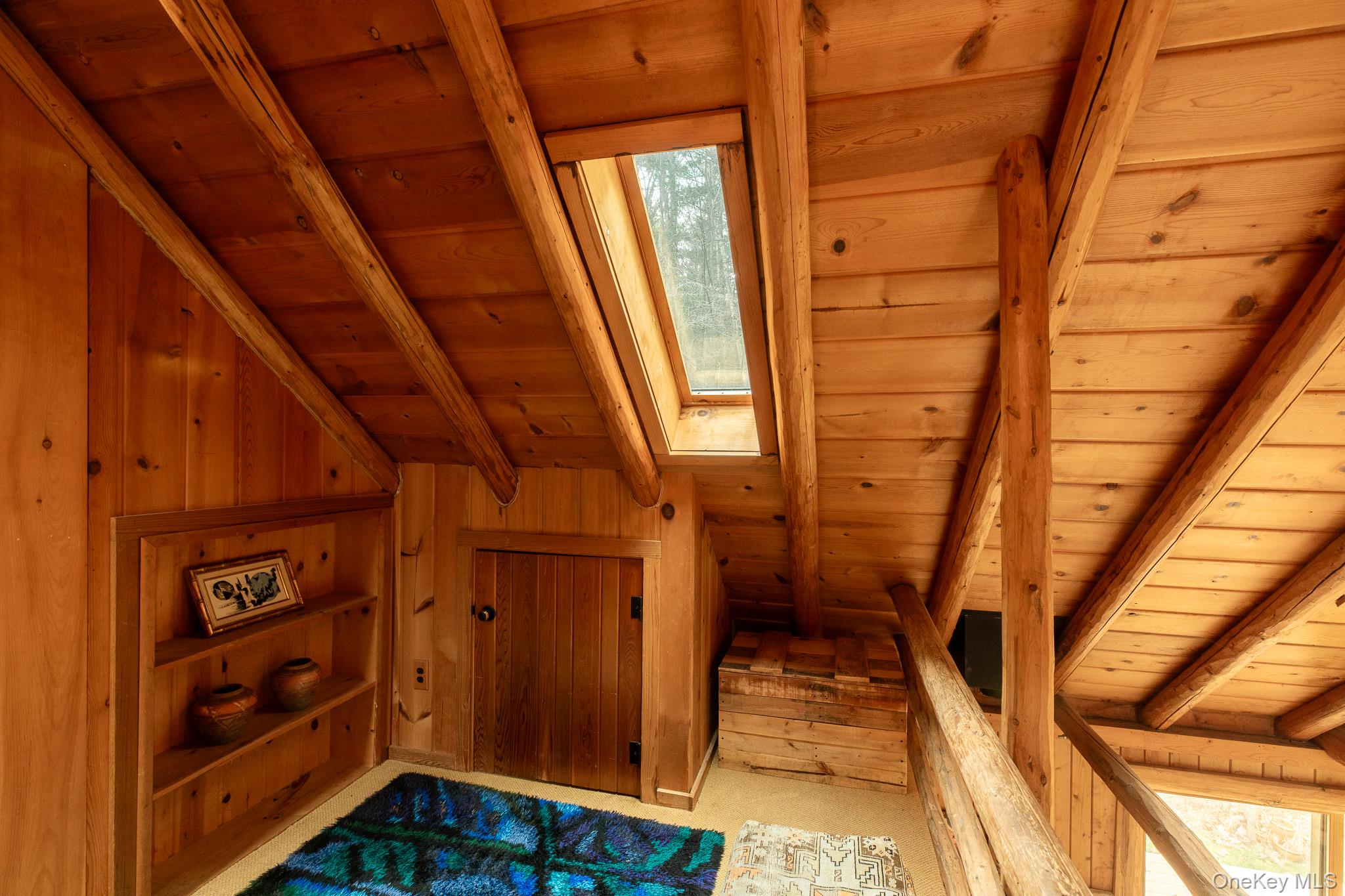 79 Torre Rock Road Red Hook, NY 12571 - Photo 26 of 33 Bonus room with a wood ceiling with exposed beams, a skylight, and wood walls
