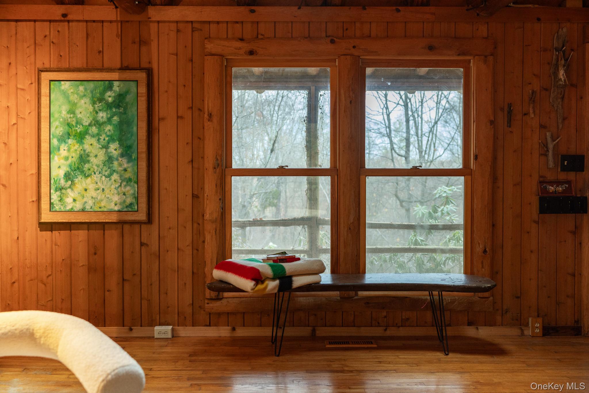 79 Torre Rock Road Red Hook, NY 12571 - Photo 9 of 33 Living area with wood walls, wood finished floors, and plenty of natural light