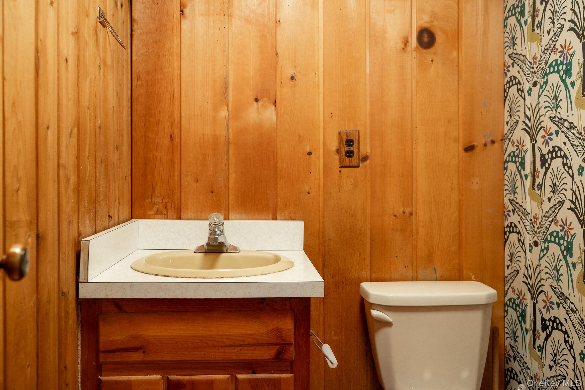 79 Torre Rock Road Red Hook, NY 12571 - Photo 10 of 33 Bathroom with wooden walls and vanity