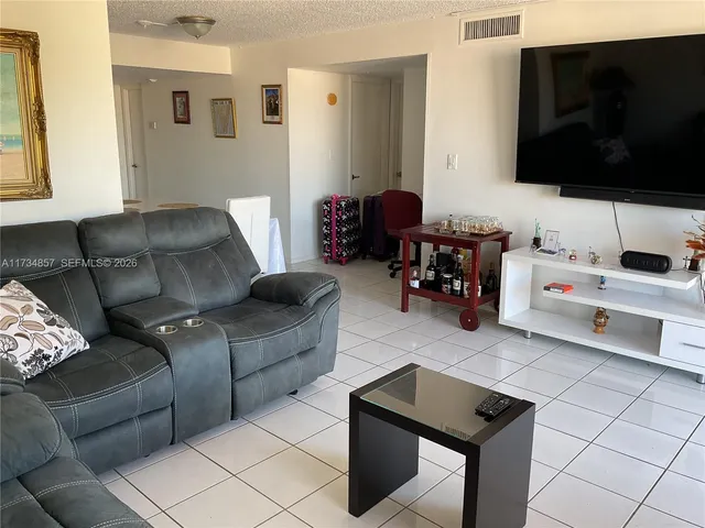 a kitchen with stainless steel appliances a sink and a refrigerator