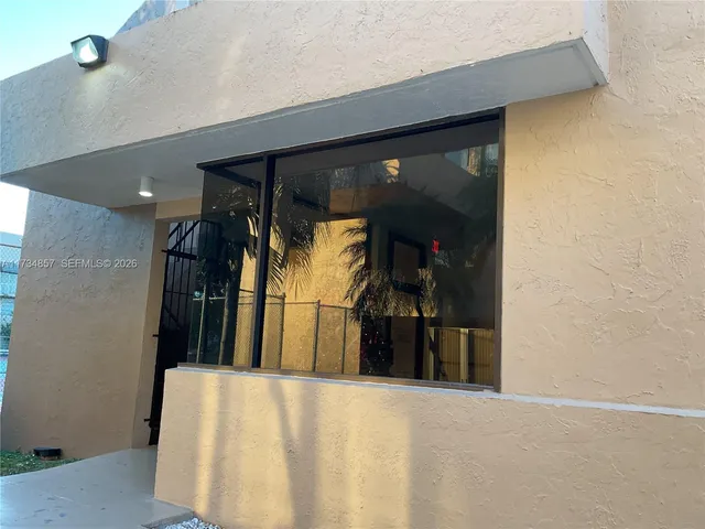 a view of a street with cars parked on road