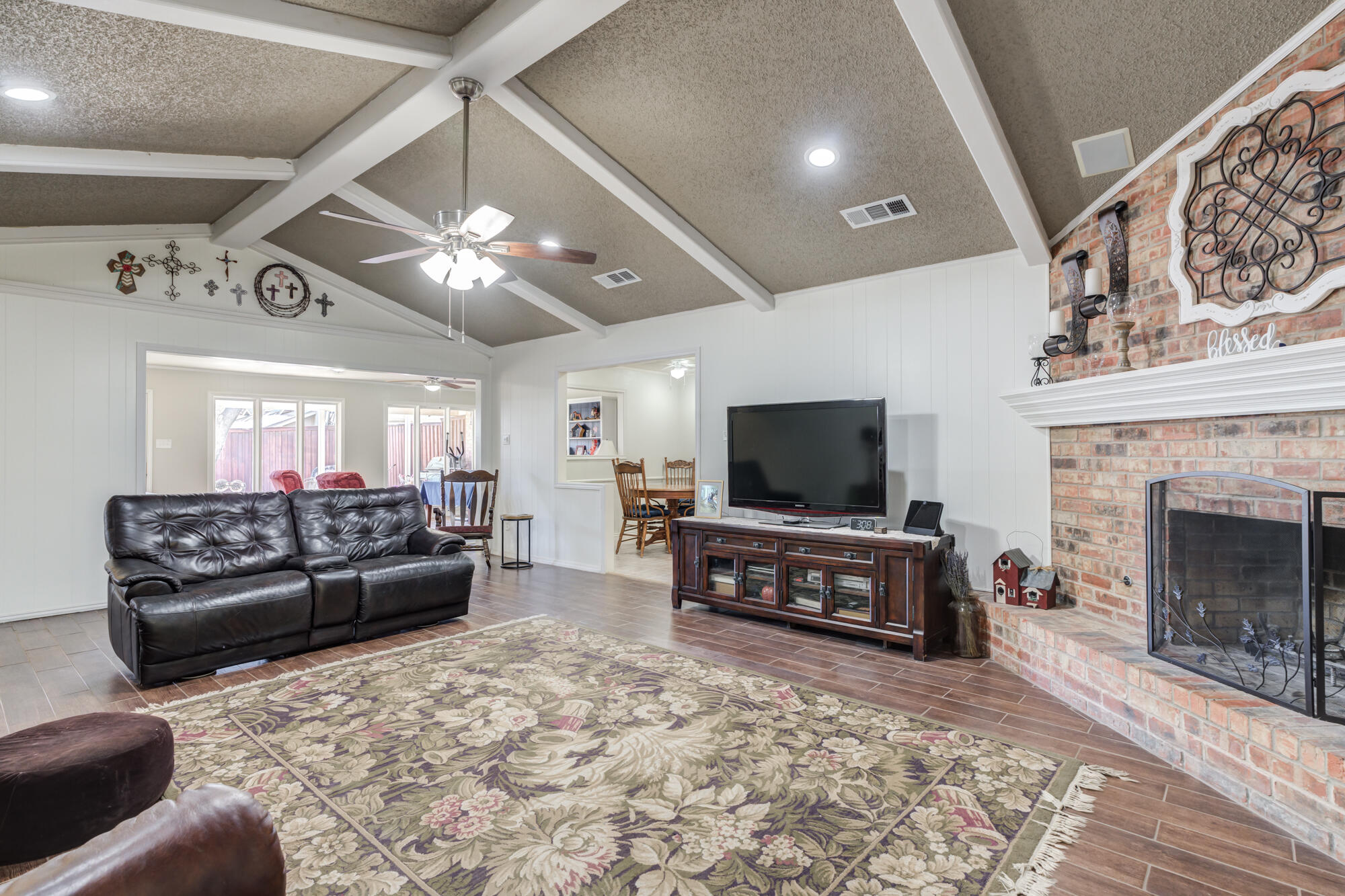 4809 78th Street Lubbock, TX 79424 - Photo 21 of 48 a living room with furniture and a flat screen tv