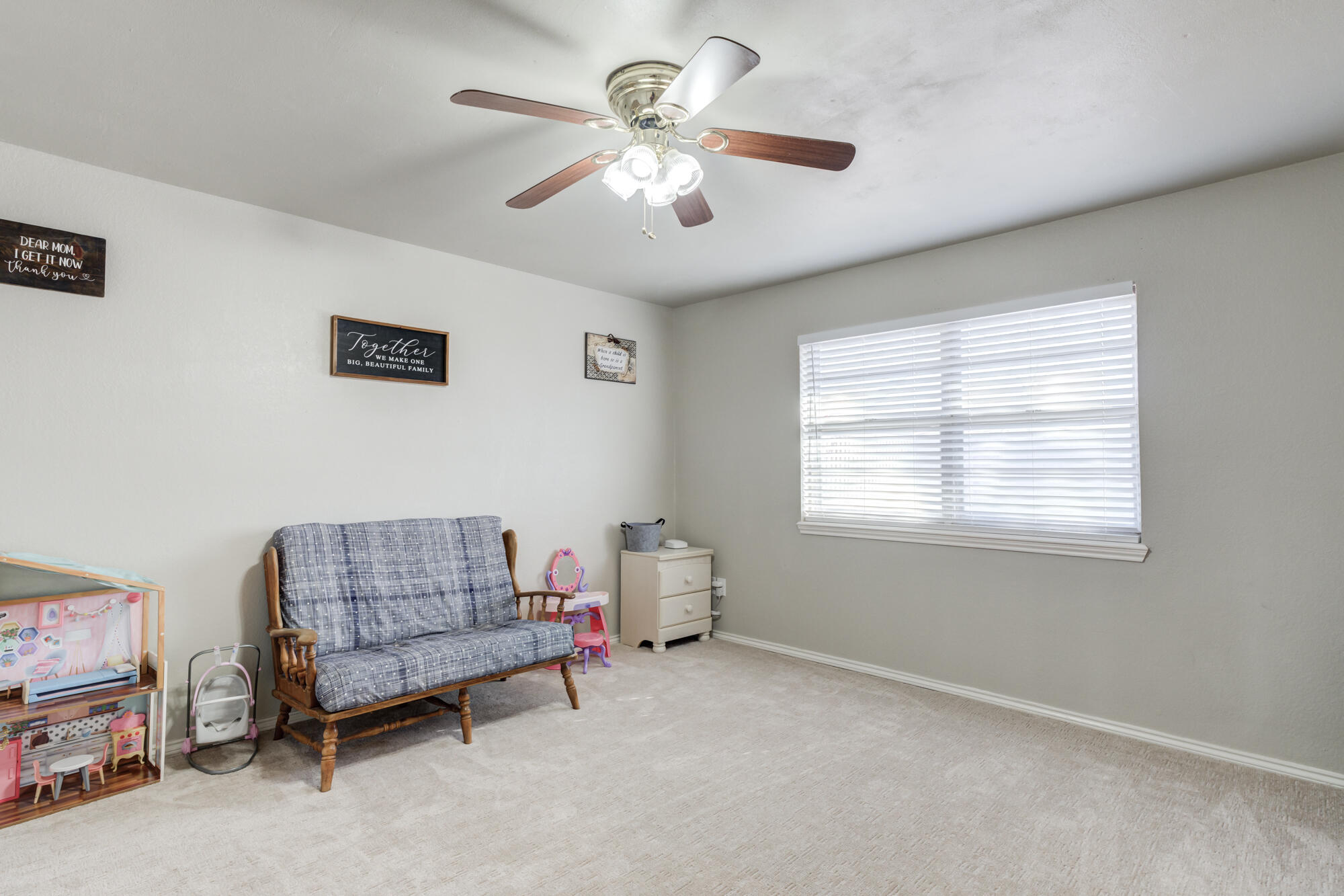 4809 78th Street Lubbock, TX 79424 - Photo 40 of 48 a living room with furniture and a chandelier