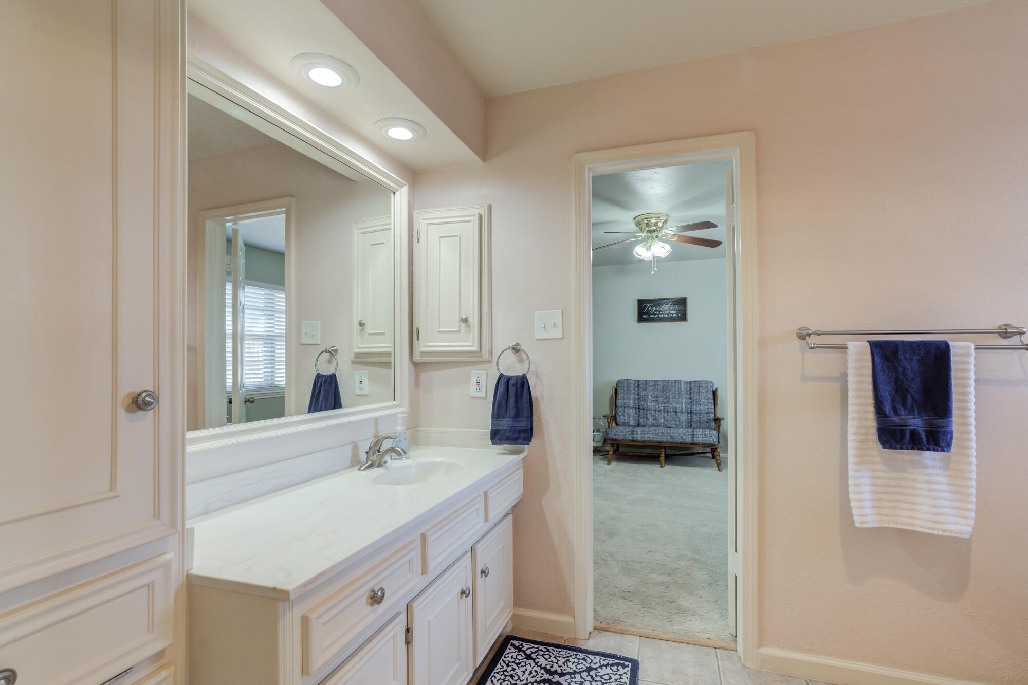 4809 78th Street Lubbock, TX 79424 - Photo 44 of 48 a en suite bathroom with a double vanity sink and mirror
