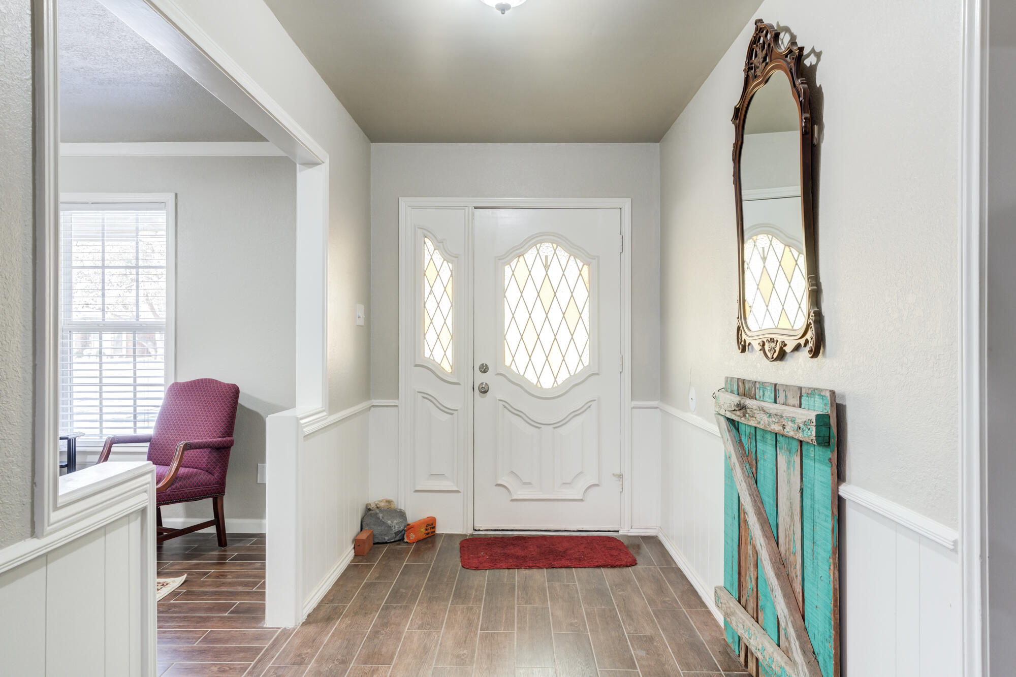 4809 78th Street Lubbock, TX 79424 - Photo 5 of 48 a living room with furniture and a wooden floor