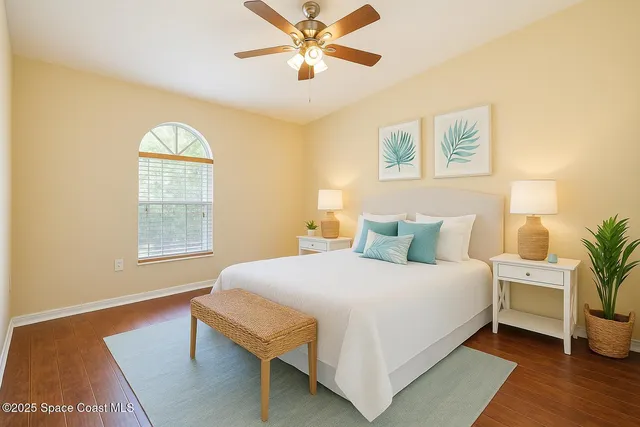 a kitchen with a sink cabinets and wooden floor