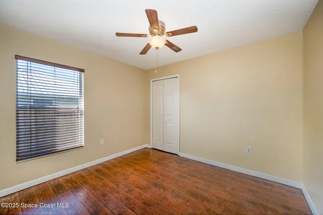 a white toilet sitting next to a bath tub