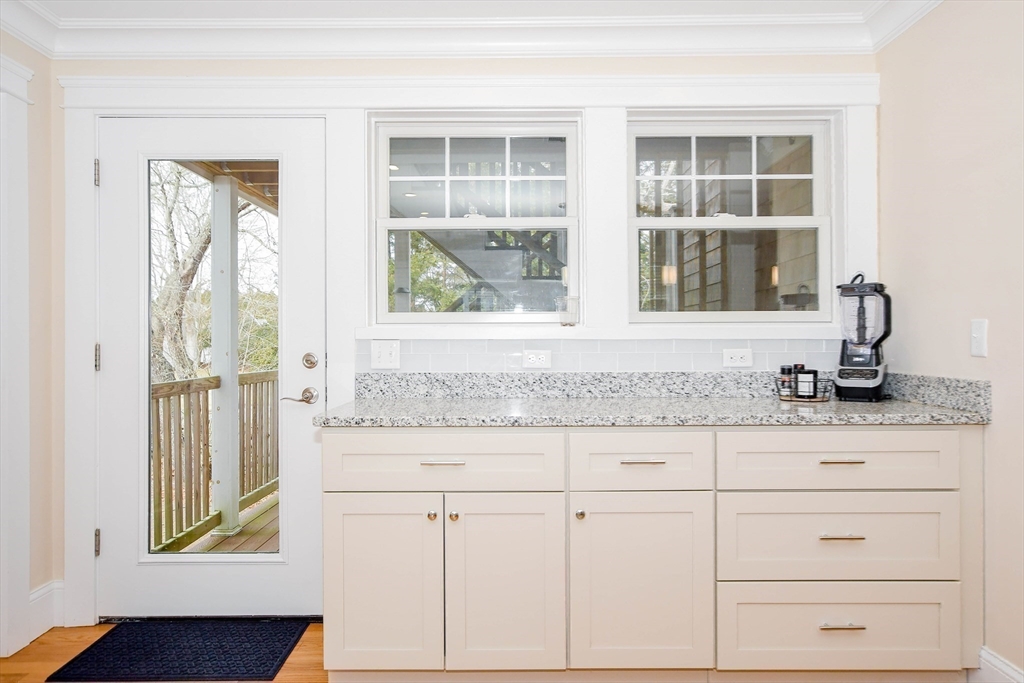 324 Front Street, Unit 2 Marion, MA 02738 - Photo 13 of 35 a bathroom with a granite countertop sink and a window