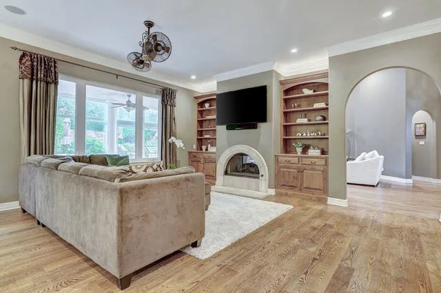 a living room with furniture and a fireplace