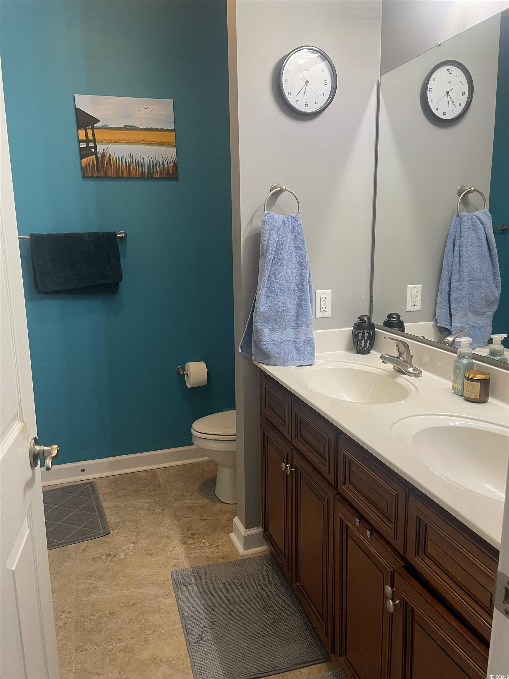 417 Cassian Way Myrtle Beach, SC 29588 - Photo 6 of 13 Bathroom featuring double vanity and light tile patterned flooring