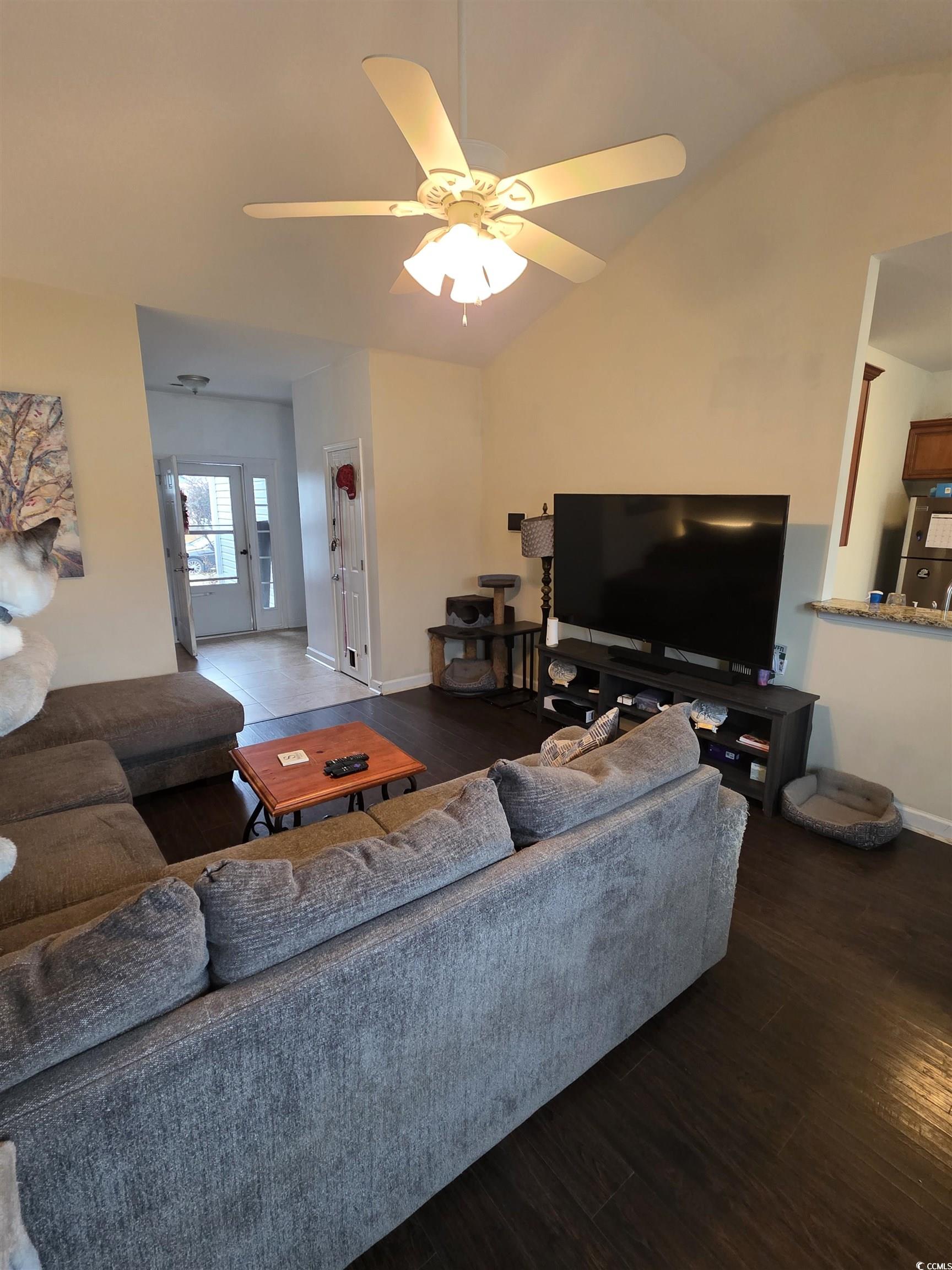 417 Cassian Way Myrtle Beach, SC 29588 - Photo 8 of 13 Living room featuring dark wood-type flooring, a ceiling fan, and lofted ceiling
