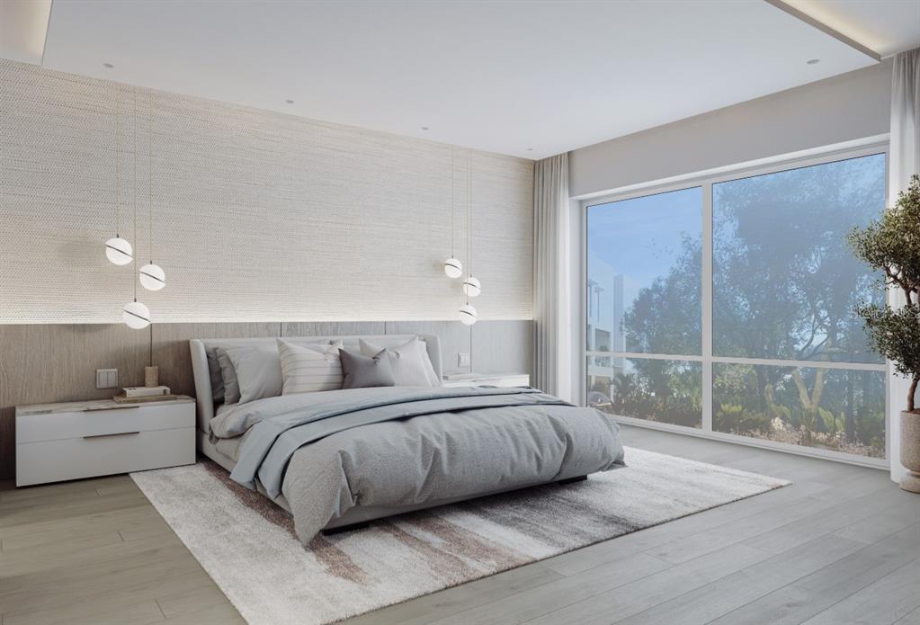 1028 Sunset Point Road, Unit R7 Clearwater, FL 33755 - Photo 6 of 23 a bedroom with a large bed and a balcony view