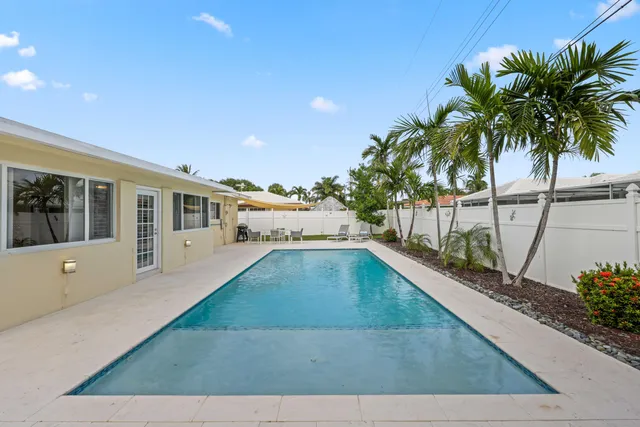 a view of a living room and a swimming pool