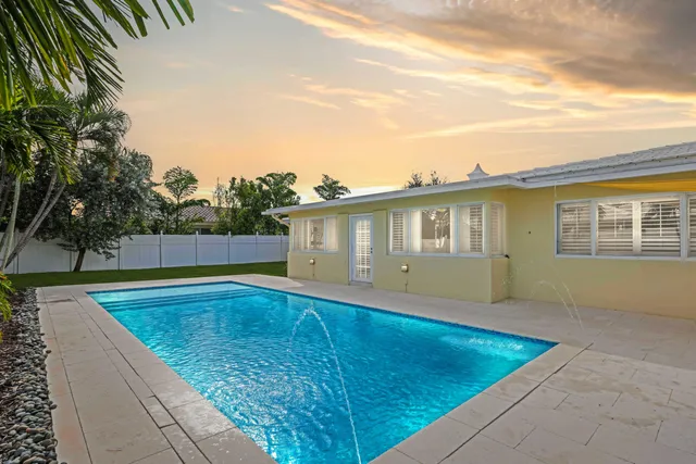 a view of a house with swimming pool