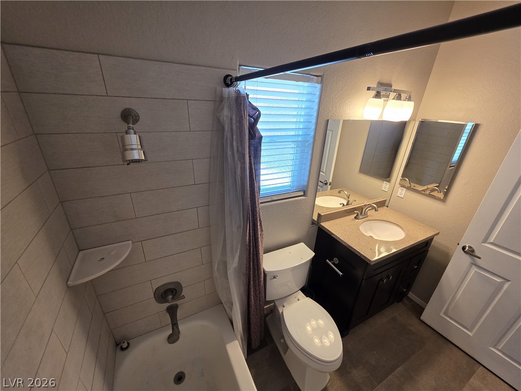 2275 Ramsgate Drive Henderson, NV 89074 - Photo 70 of 84 A well-appointed bathroom features a practical vanity with ample counter space and a sleek shower-tub combination.