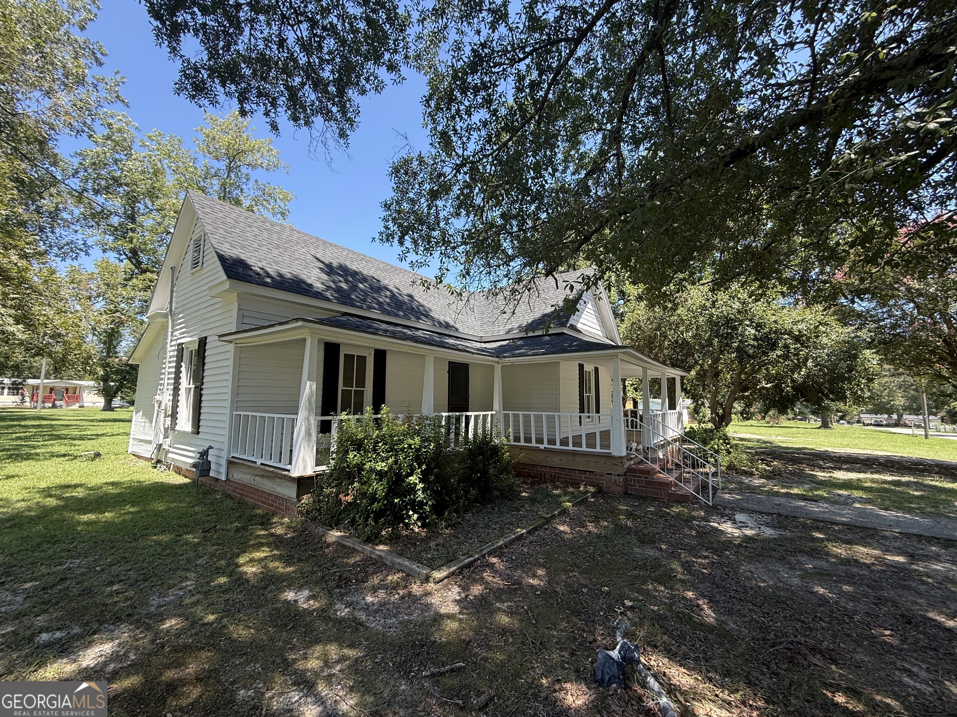 604 Shy Street Dexter, GA 31019 - Photo 11 of 36 a view of a house with a yard