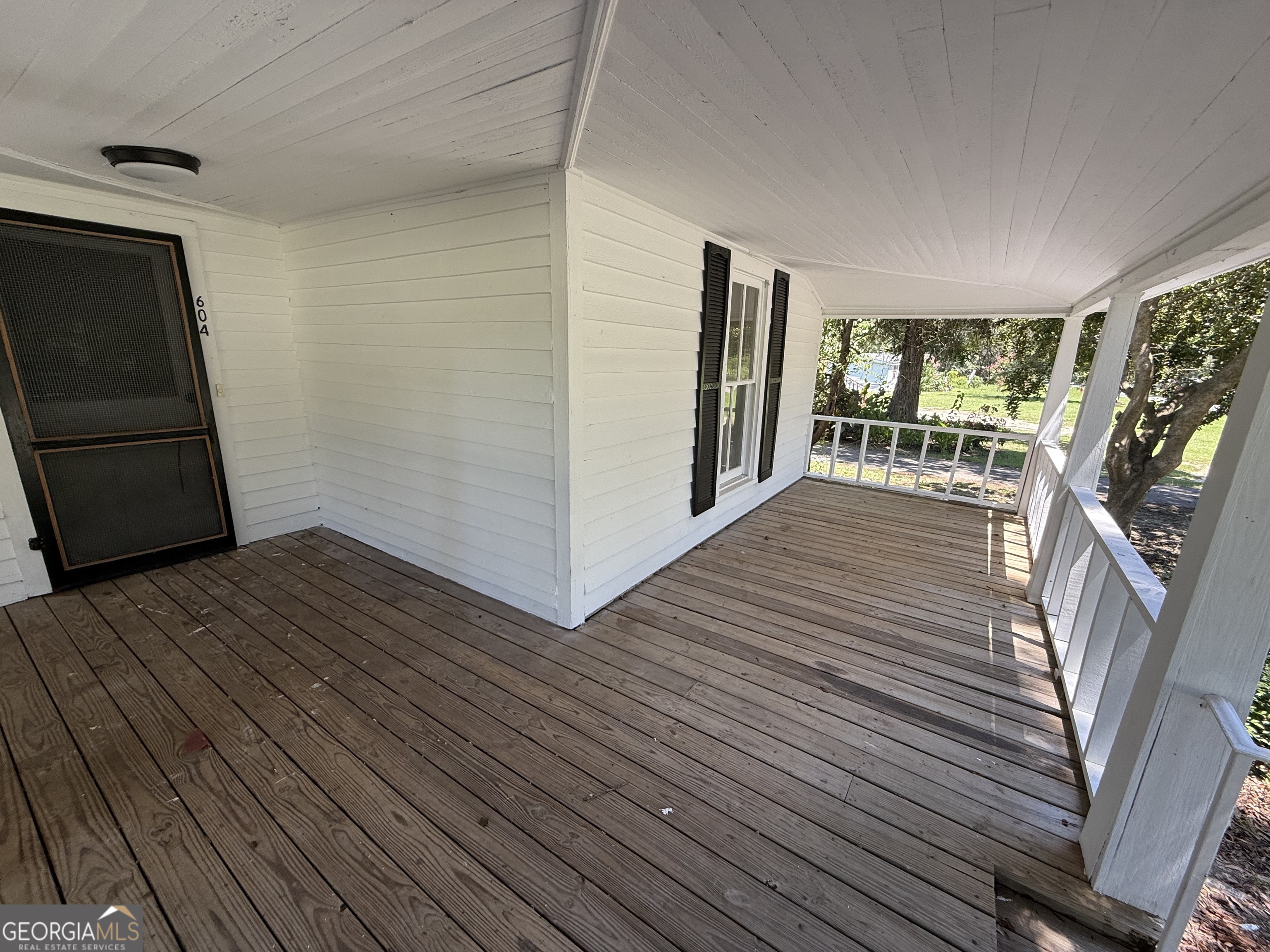 604 Shy Street Dexter, GA 31019 - Photo 15 of 36 a view of a livingroom with wooden floor and stairs