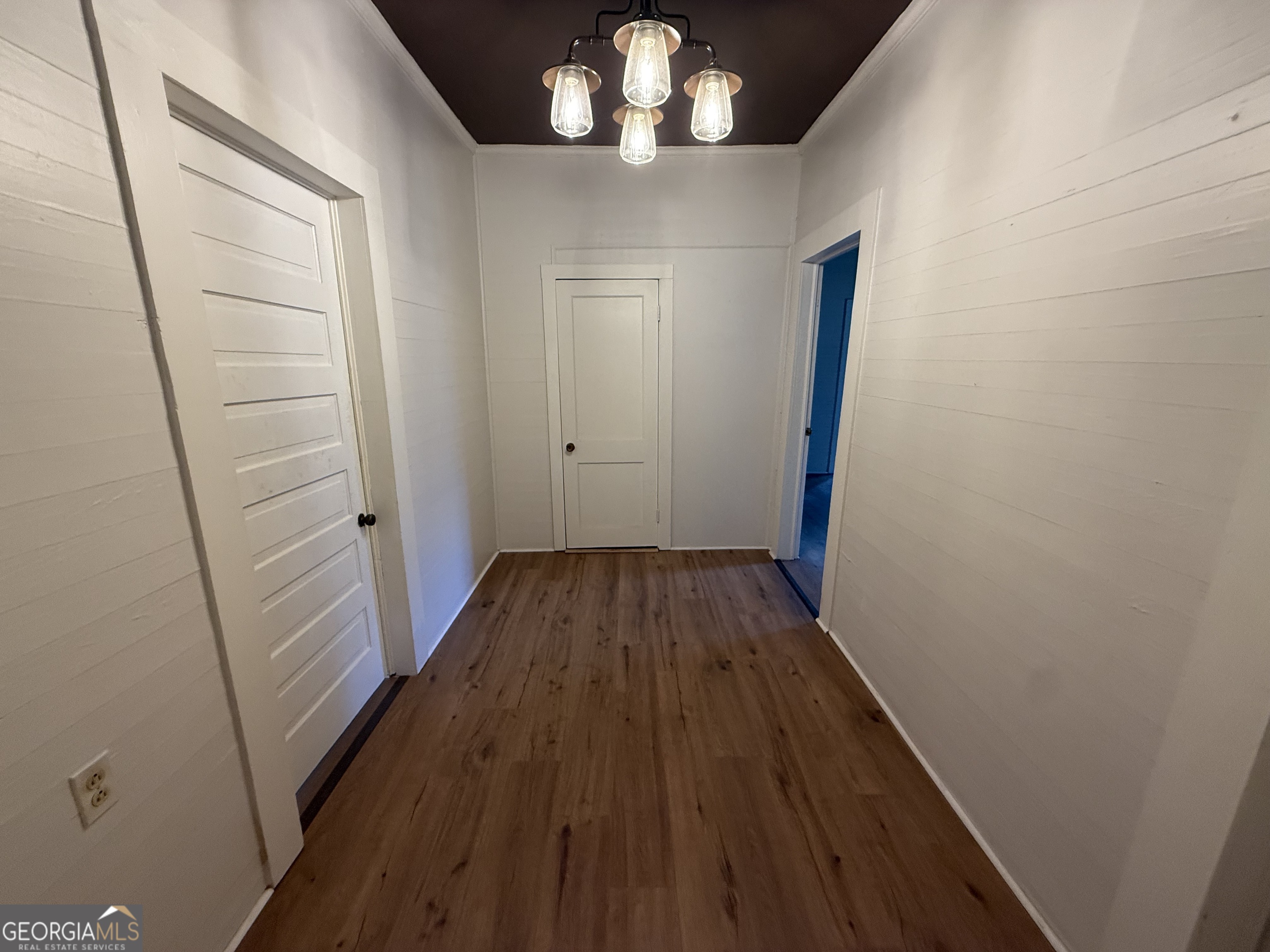 604 Shy Street Dexter, GA 31019 - Photo 16 of 36 a view of a hallway with wooden floor and staircase