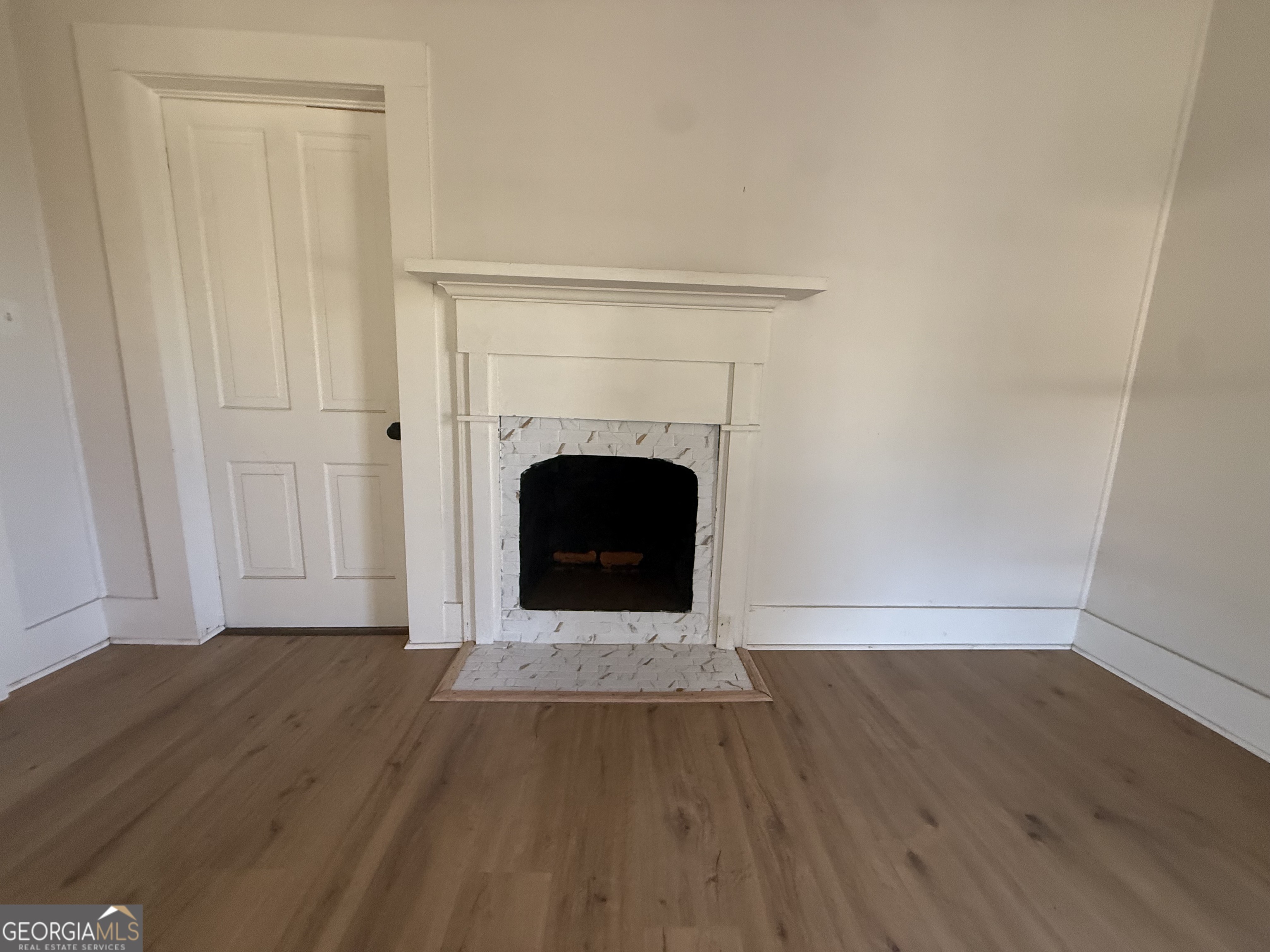 604 Shy Street Dexter, GA 31019 - Photo 25 of 36 a living room with a fireplace