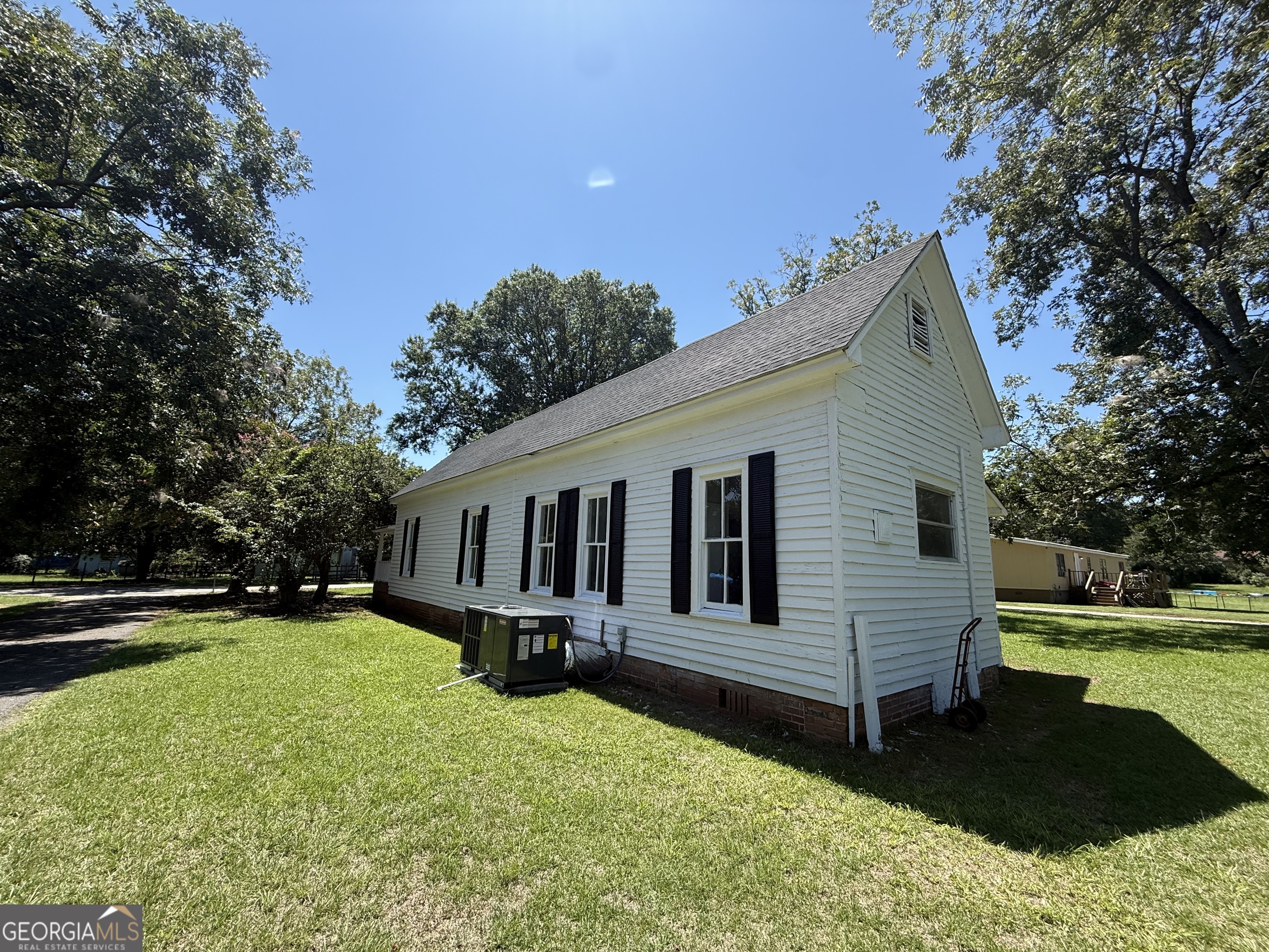 604 Shy Street Dexter, GA 31019 - Photo 7 of 36 a front view of a house with a yard