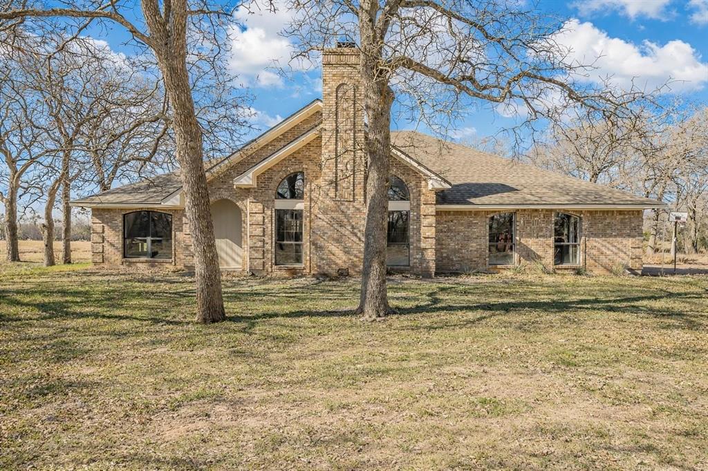 1325 North Katy Road Elm Mott, TX 76640 - Photo 29 of 30 a front view of a house with a garden