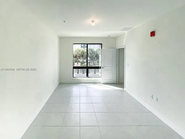 a view of an empty room with a window