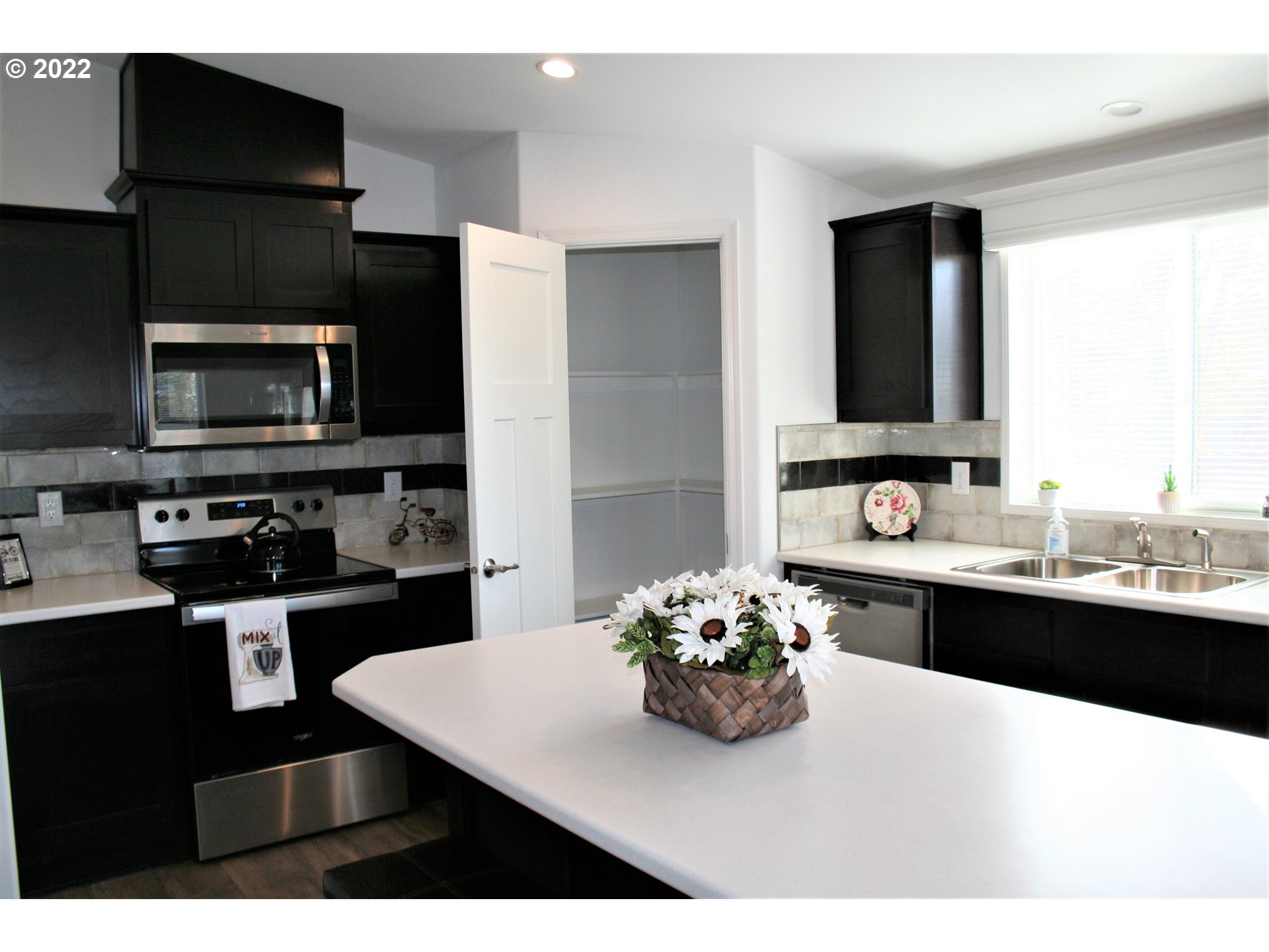4693 Union Terrace Springfield, OR 97478 - Photo 6 of 19 a kitchen with a sink and cabinets